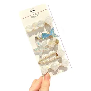 5-piece ocean theme hair clip set with starfish, shell and mermaid tail pearls