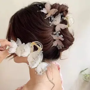 Elegant 3D butterfly hair claw clip with sheer fabric wings and beaded tassels for women
