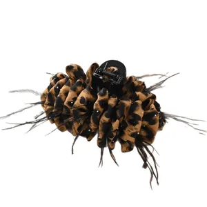 Elegant leopard print flower hair claw clip with black feathers and rhinestones