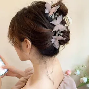 Large butterfly hair claw clip with pink tulle wings and elegant pearls for women