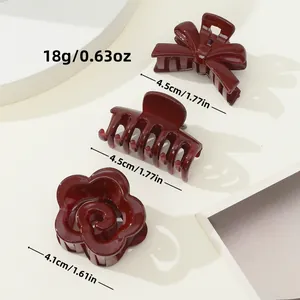 Three-piece set of dark red mini hair claws in bow, classic, and flower shapes