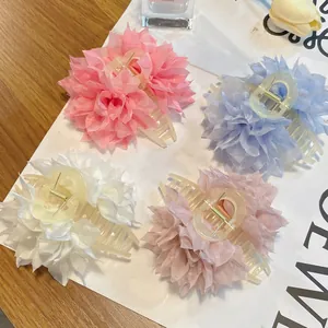 Set of four pastel chiffon flower hair claws in pink, blue, and white colors