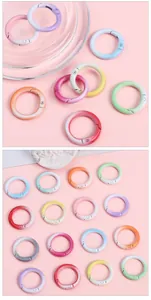 Macro shot of colorful gradient round spring alloy rings for DIY bag accessories