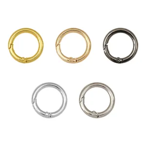 Five assorted metal spring O-rings in gold, silver, and black for DIY bag accessories