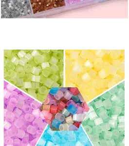 Detailed close-up of vibrant mixed color plastic fusion beads and organized storage case