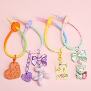 Silicone flower gradient keychains with cute charms including heart cookies and puppy