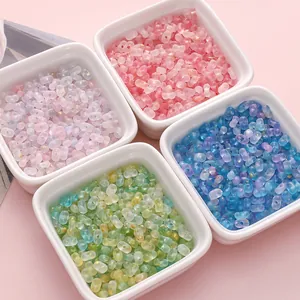 Macro shot of 4x6mm acrylic peanut beads with gold glitter for DIY jewelry making