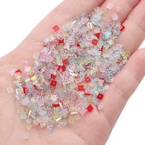 Mix of 1x3mm colorful AB coating crystal square glass beads held in hand for DIY jewelry