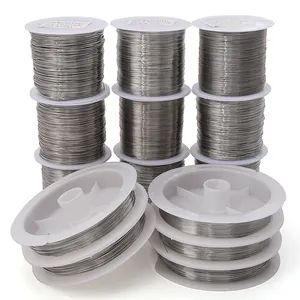 Stack of stainless steel beading wire spools for jewelry making in various gauges