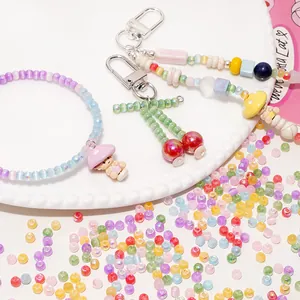 Handmade pastel beaded bracelet and keychains set with colorful aurora cat eye glass beads