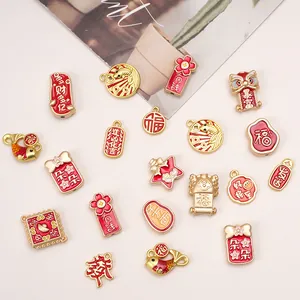 Assorted gold-plated koi fish and lucky charms for DIY jewelry making with red enamel