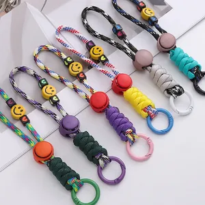 Colorful paracord keychain set with smiley beads and alloy rings for bags and DIY crafts
