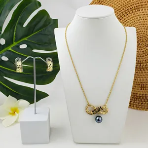 Golden MOM infinity jewelry set with engraved hoop earrings and shell pearls