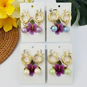 Set of four 18K gold plated hoop earrings with colorful pearl charms on Aloha card