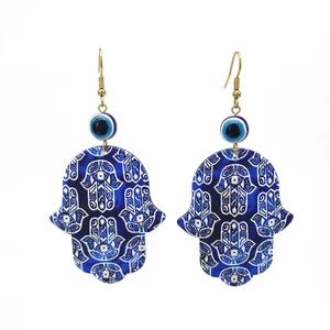 Detailed view of Hamsa Hand and Evil Eye acrylic earrings with intricate mandala patterns