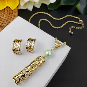 Polynesian golden Honu sea turtle jewelry set with hollow metalwork and shell pearls