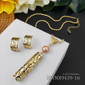 Close-up of golden tropical hollow flower jewelry set with pink pearls and size detail