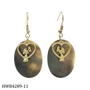 Detailed shot of tropical shell earrings with golden heart cutout and iridescent finish