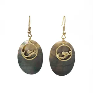 Tropical oval black shell drop earrings with golden mermaid silhouette in a vintage style