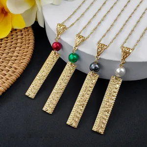 Detail of four floral necklace variants with rectangle charms and colorful pearl beads