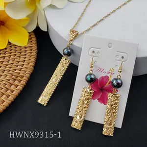 Hawaiian gold necklace and earrings set with iridescent pearls and engraved bar design
