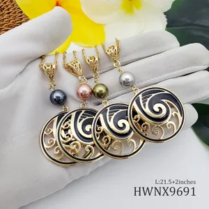 Polynesian style pearl necklaces with black enamel wave pendants in gold plating
