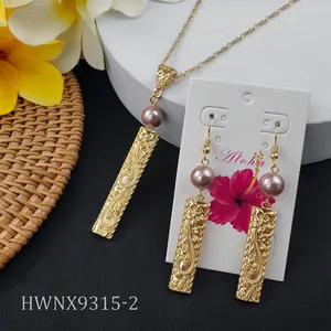 Hawaiian gold necklace and earrings set with purple pearls and floral engravings