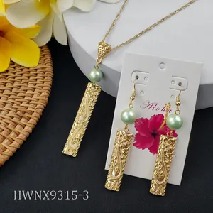 Hawaiian bar jewelry set with necklace and shell pearl earrings on a woven tropical mat