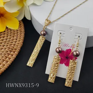 Detailed engraving on gold-plated bar pendant with dark purple pearl accents for women