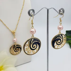 Golden Hawaiian pearl jewelry set with wave enamel necklace and matching earrings
