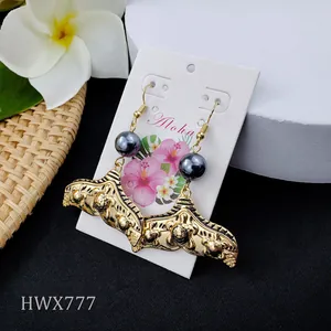 Vintage whale tail earrings with gray pearl and gold engraved pendants in aloha style