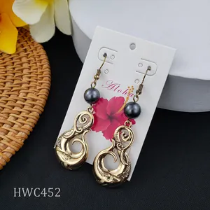 Vintage gold Samoan seal earrings with black pearls and ocean wave pattern