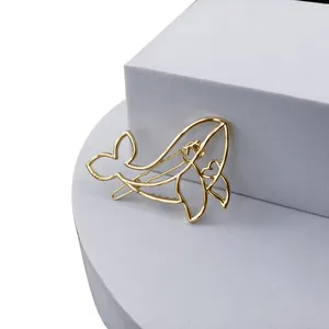 Pince à cheveux minimaliste dorée en métal ajouré en forme de baleine polie