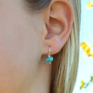 Handmade turquoise stone earrings with silver stainless steel hooks in outdoor setting