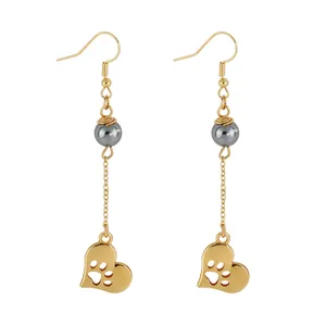 Golden drop earrings with grey pearl and heart-shaped animal claw print cutout charms