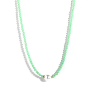 Detail shot of light green faceted crystal beads and large white faux pearl on choker