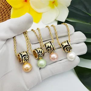 Detail of Samoa totem necklaces featuring black enamel and colorful pearls in tropical style