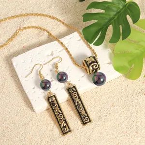 Polished Hawaiian tribal jewelry set with black enamel, golden relief and purple pearls
