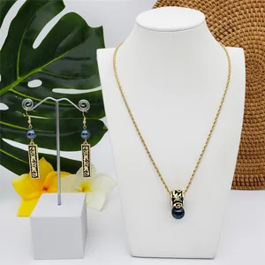 Exotic Hawaiian Samoa jewelry set with black enamel totem pendant and pearl accents