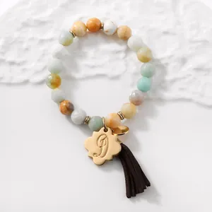 Amazonite beaded bracelet with gold letter D pendant and brown suede tassel charm