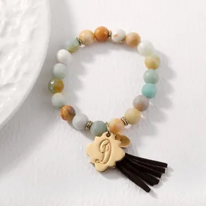 Amazonite stone beaded bracelet with golden initial J pendant and brown tassel accent