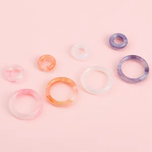 Colorful acrylic marble texture rings in pink orange and purple for DIY jewelry making
