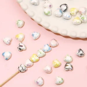 Colorful pearlized heart-shaped ceramic beads with ink wash patterns for DIY jewelry making