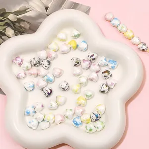 Colorful marble heart ceramic beads in a star dish for DIY jewelry making