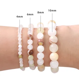 Braccialetti di perle di giada ciana in dimensioni 4mm, 6mm, 8mm e 10mm mostrati al polso