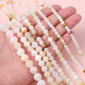 Perline tonde in giada sintetica color crema e beige per creazione di gioielli fai da te