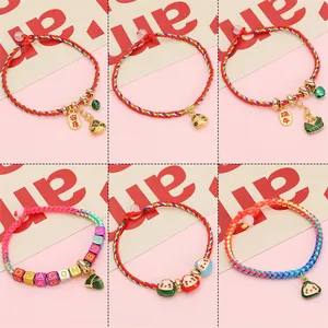 Handmade Dragon Boat Festival woven bracelets with enamel zongzi charms and lucky tags