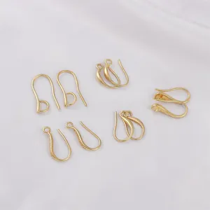 Varios ganchos para pendientes en U de oro de 14K para bisutería DIY en seda blanca