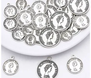 Detail showing vintage silver alloy coin pendant with Queen Elizabeth relief for DIY jewelry