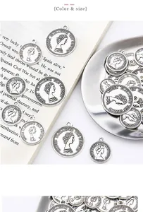 Macro detail of silver alloy Elizabeth II coin pendants for vintage DIY jewelry making